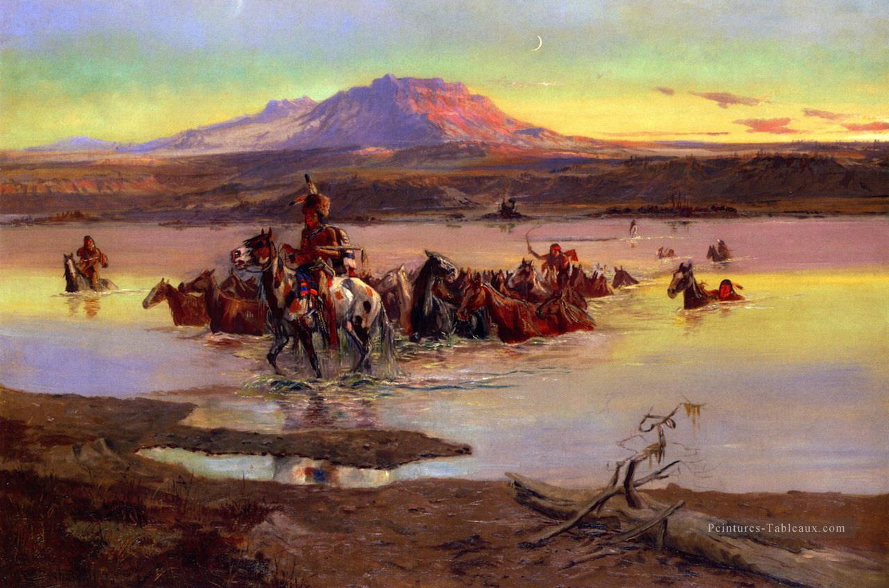 passage à gué le troupeau de chevaux 1900 Charles Marion Russell Peintures à l'huile